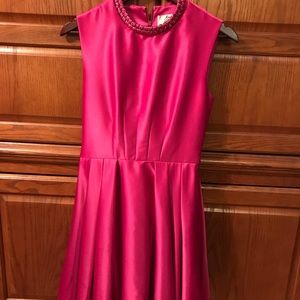 Magenta couture dress with braided collar.